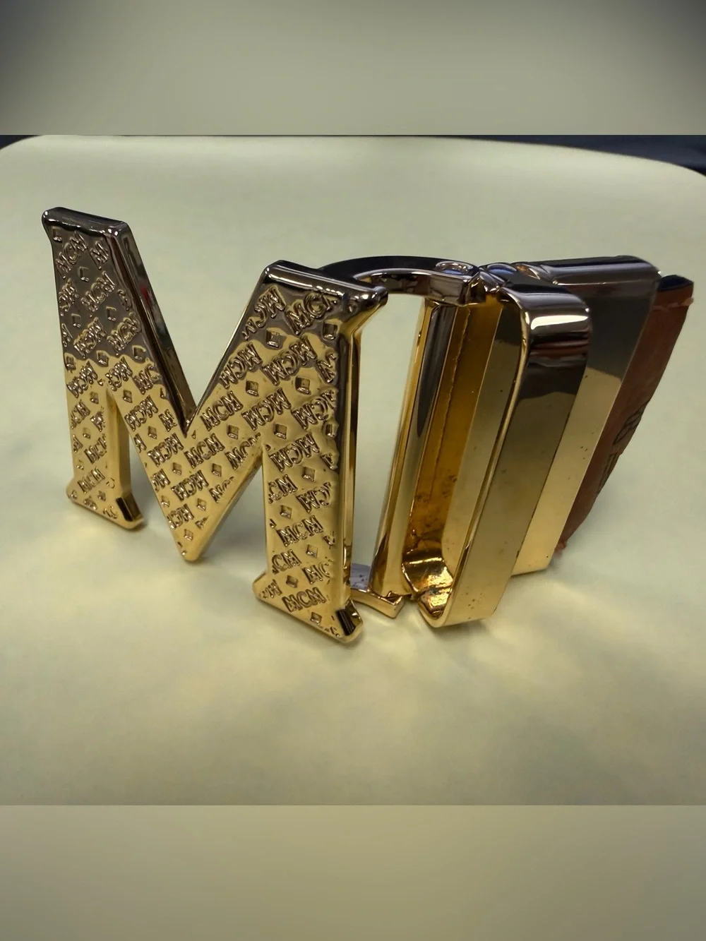 MCM Gold Tone Initial “M” Automatic Ratchet Belt Buckle Designer Logo